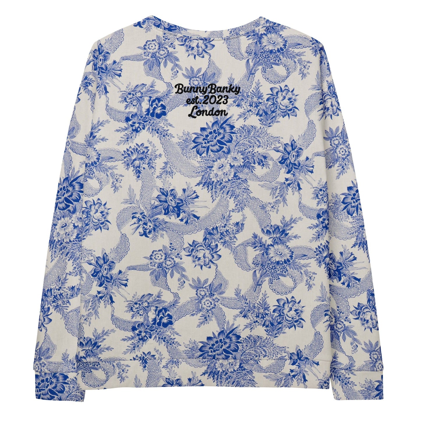 The Saint Germain Sweatshirt, highlighting the "Goal Digger" embroidery on blue floral pattern on cream fabric and the iconic signature logo at the back.