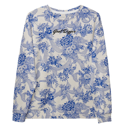 The Saint Germain Sweatshirt, highlighting the "Goal Digger" embroidery on blue floral pattern on cream fabric and the iconic signature logo at the back.