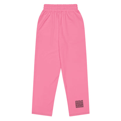 A close-up of The Seoul Pink Flow Wide Joggers, highlighting the playful Pop Cherry print, heritage logo, and the binary code pattern on the back left leg.