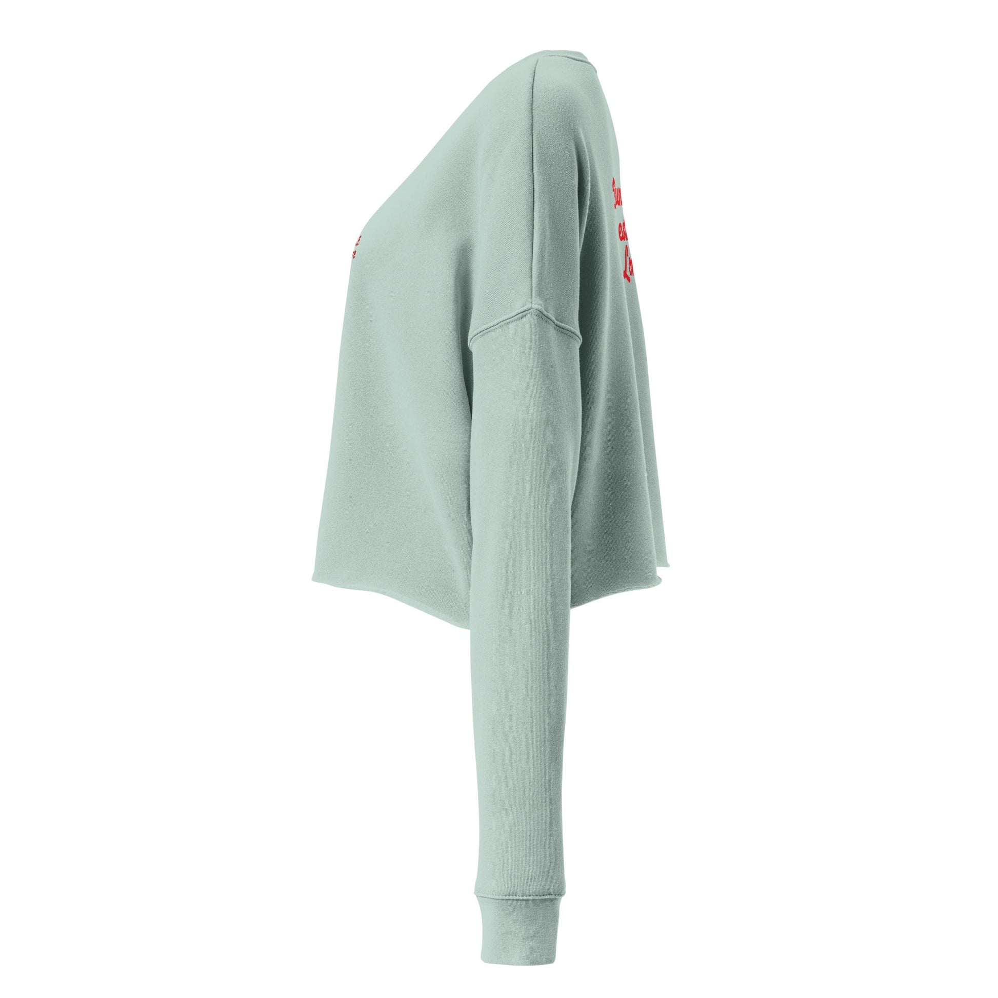 A close-up of The Sisterhood Crop Sweatshirt, highlighting the premium embroidery of the "Female Culture" motto and the soft, ring-spun cotton fabric texture.