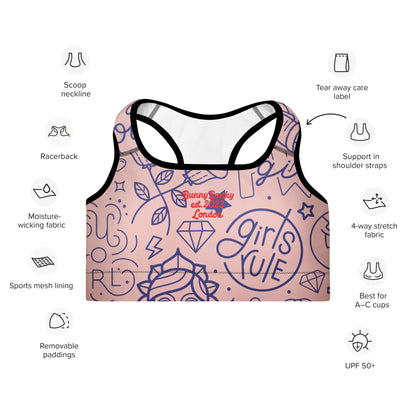 A close up of The Sisterhood Performance Bra, showing the supportive fit and the high-impact "Girl Power" collage print.
