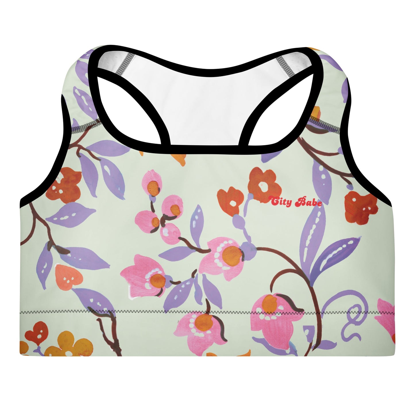 A close-up of The Sloane Square Performance Bra, highlighting the soft recycled fabric and the elegant pastel pink and lilac floral print.