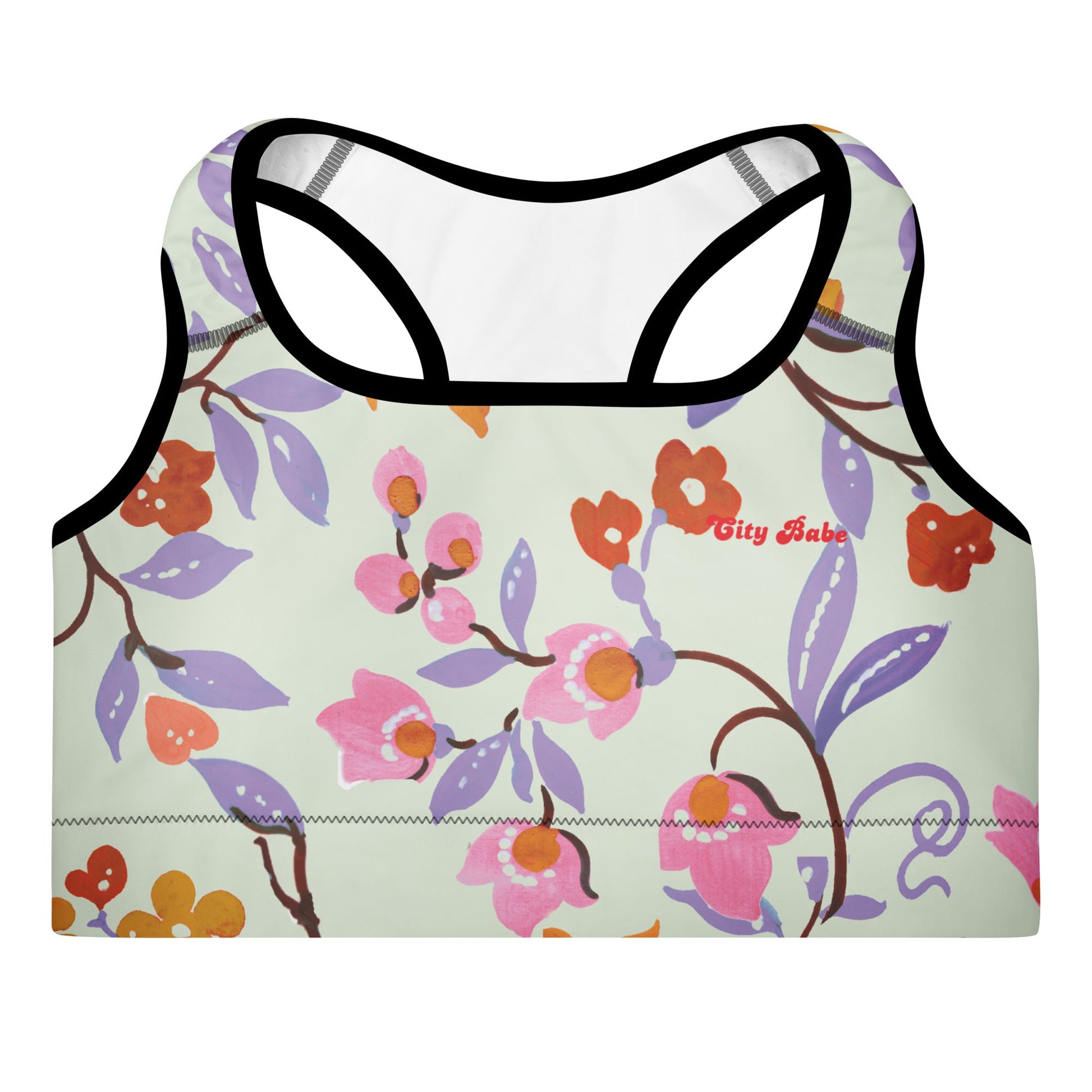 A close-up of The Sloane Square Performance Bra, highlighting the soft recycled fabric and the elegant pastel pink and lilac floral print.