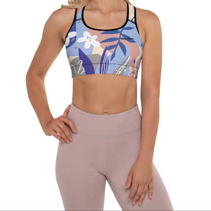 A model wearing the surrey performance bra with the print city babe on a floral print with lilac and beige hues