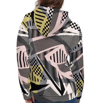 A model wearing the Sydney Hoodie. The image highlights the Art Deco-inspired pattern of checkers and pinstripes in soft pink, sand, and olive tones, featuring red London branding.