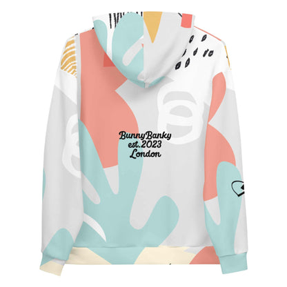 Close-up of the Terra Resort Hoodie. The image focuses on the intricate earth-tone patterns and the soft, high-quality finish of the recycled brushed fleece fabric.