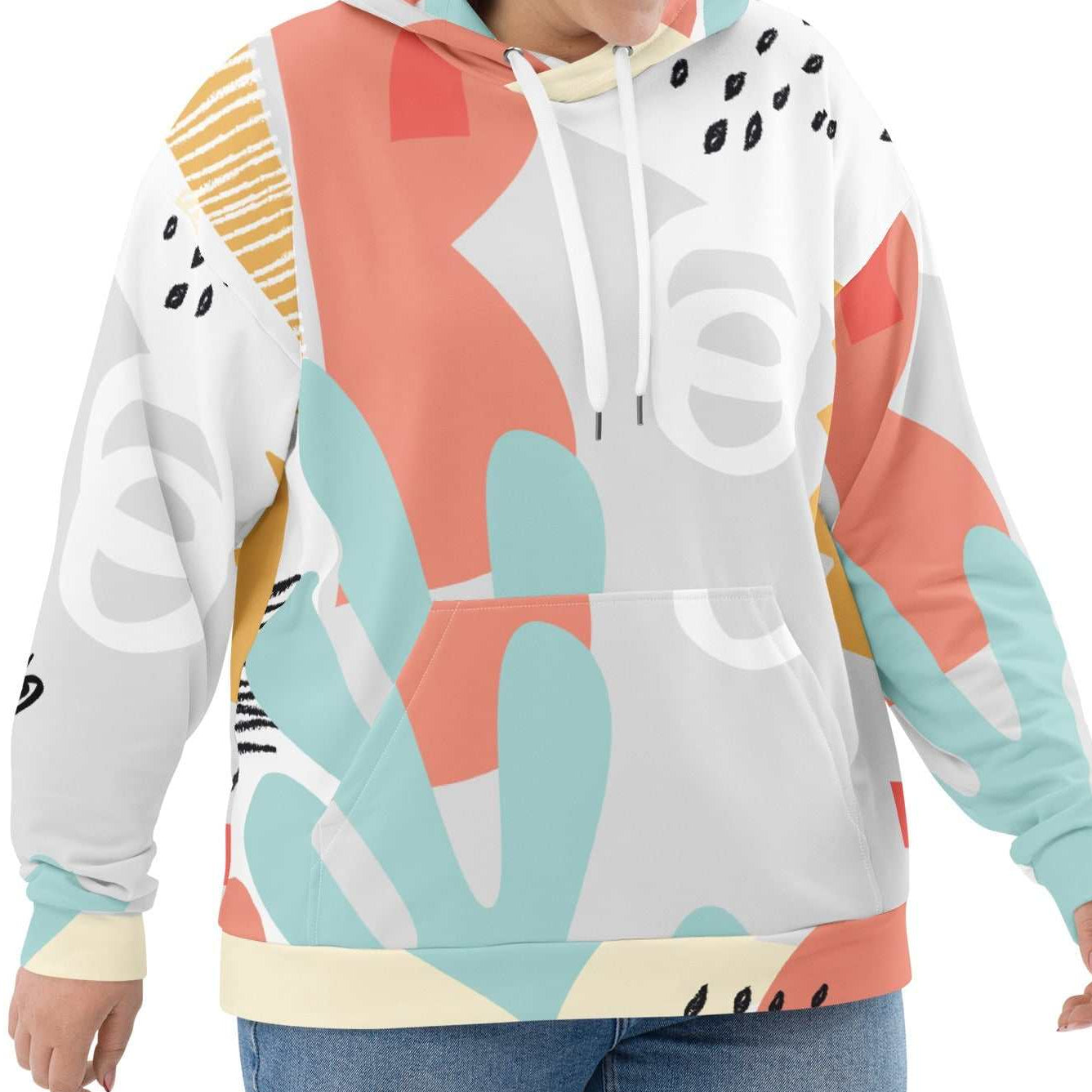 Close-up of the Terra Resort Hoodie on a model. The image focuses on the intricate earth-tone patterns and the soft, high-quality finish of the recycled brushed fleece fabric.