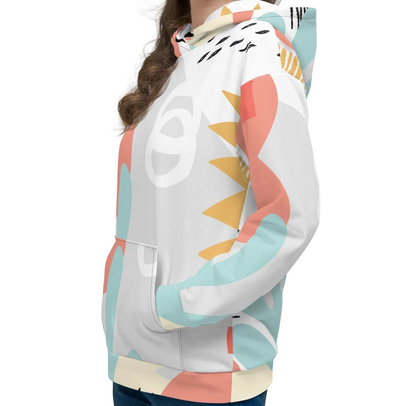 Close-up of the Terra Resort Hoodie on a model. The image focuses on the intricate earth-tone patterns and the soft, high-quality finish of the recycled brushed fleece fabric.