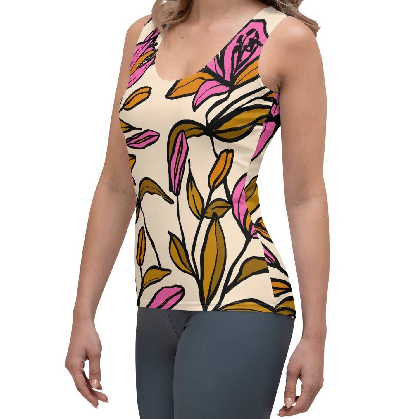 Model wearing the Terra Performance Tank featuring vibrant pink  and green floral pattern on soft cream  fabric.