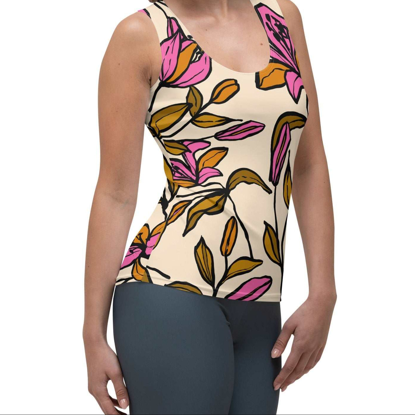 Model wearing the Terra Performance Tank featuring vibrant pink  and green floral pattern on soft cream  fabric.