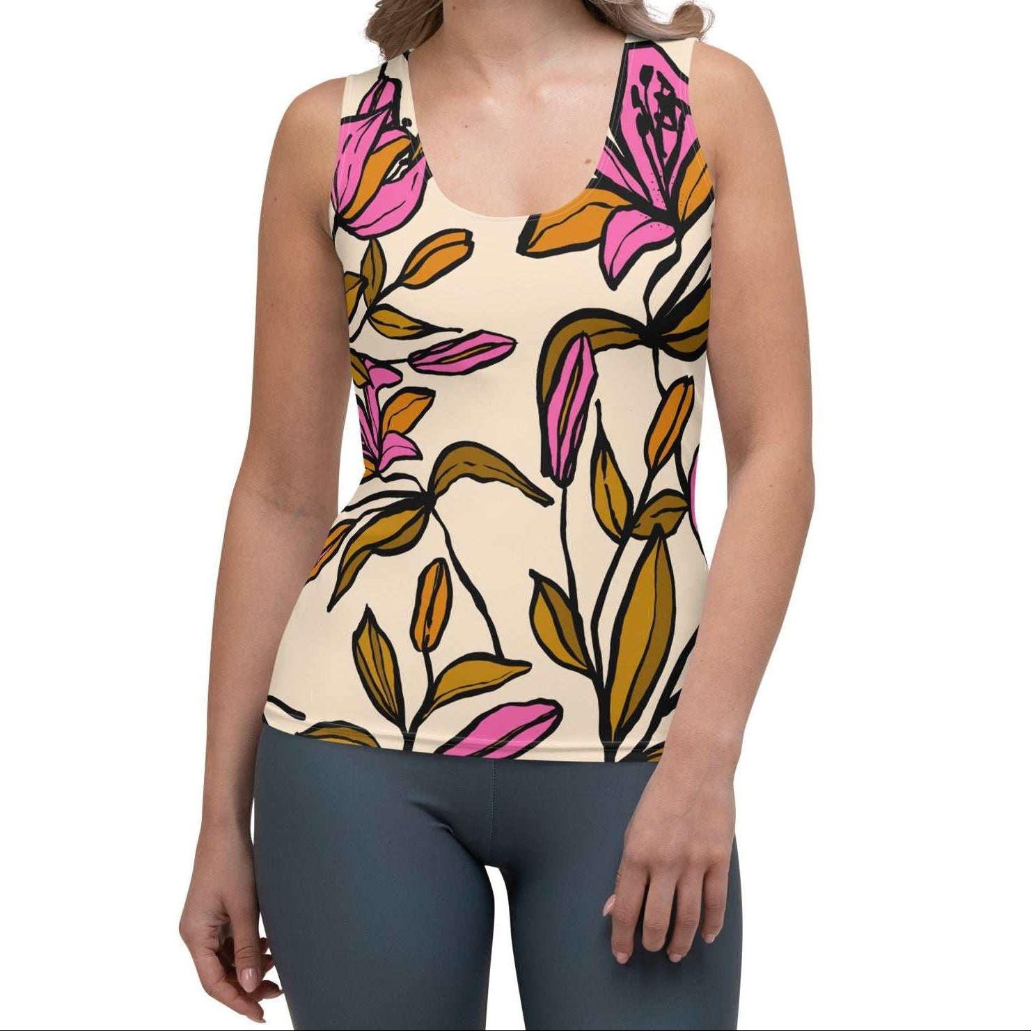 Model wearing the Terra Performance Tank featuring vibrant pink  and green floral pattern on soft cream  fabric.