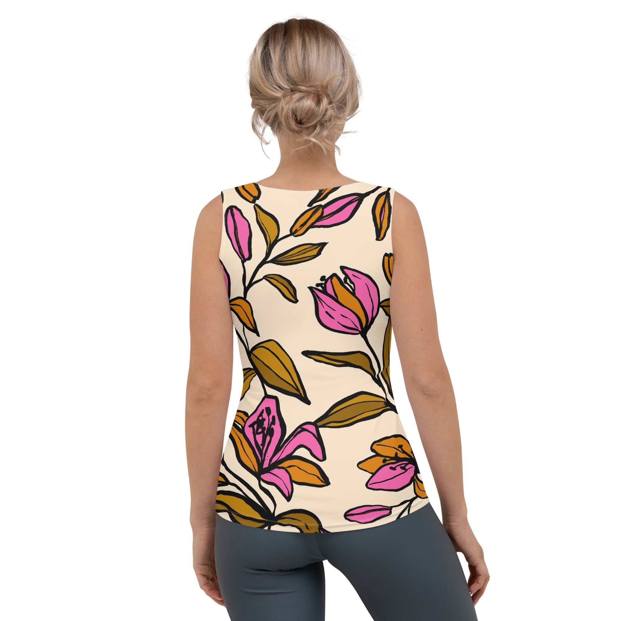 Model wearing the Terra Performance Tank featuring vibrant pink  and green floral pattern on soft cream  fabric.