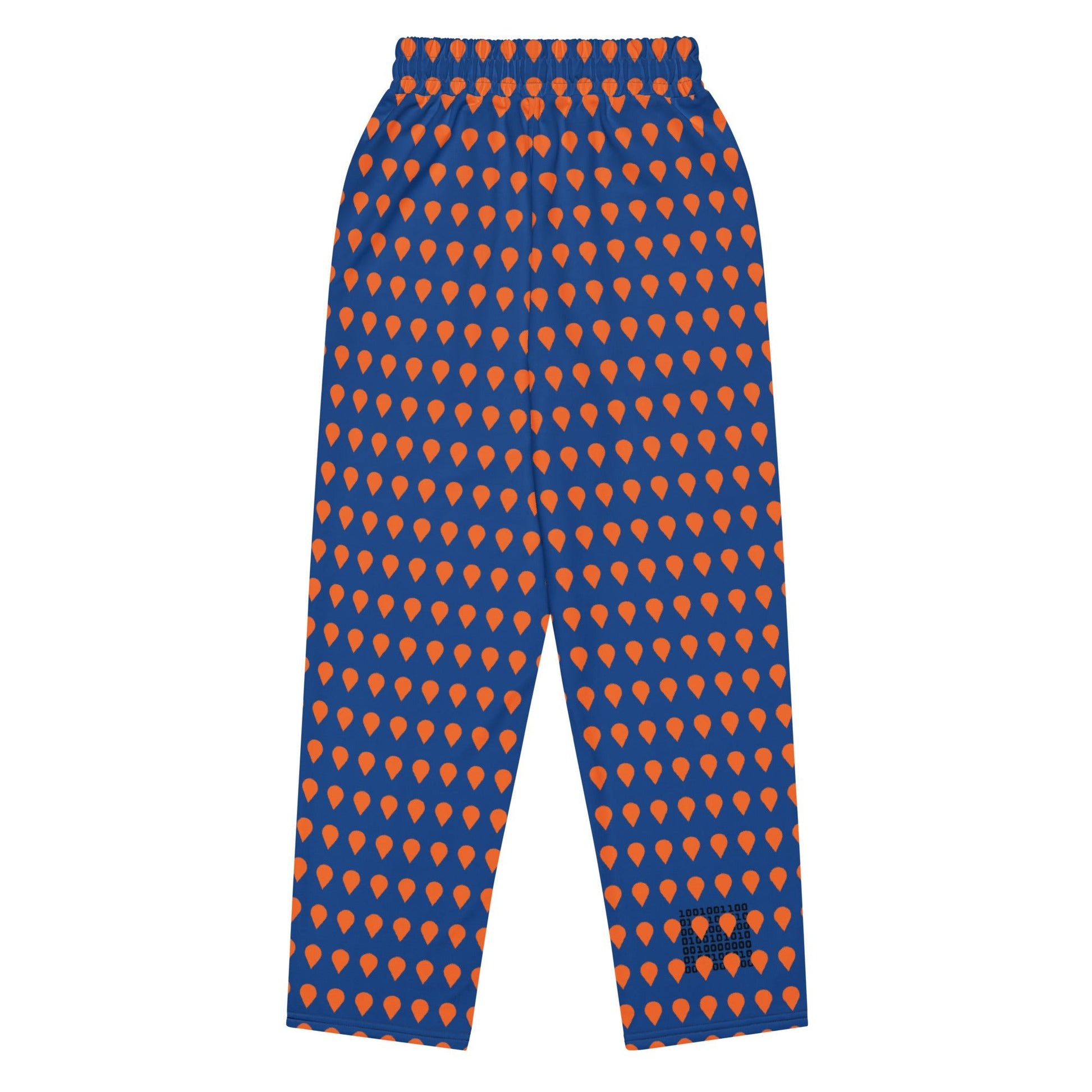 A close up of The Thames Flow Joggers, showing the wide-leg, relaxed silhouette and the orange drop print on the deep navy blue background.