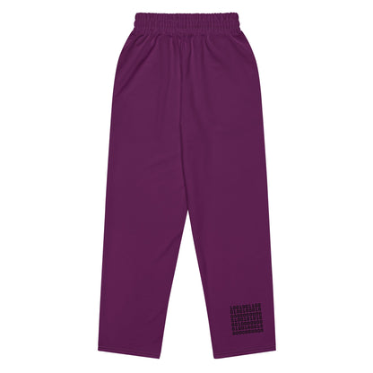 A close-up of The Tokyo Purple Flow Wide Joggers, highlighting the unique binary code print (1s and 0s) printed on the back left leg, fusing data and style. 