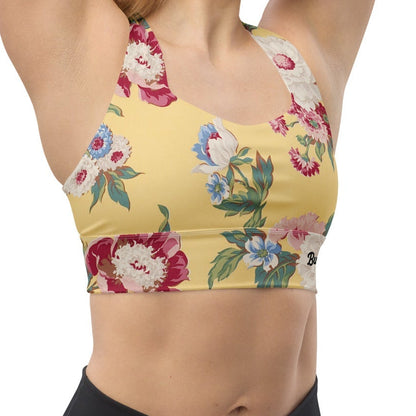 Model wearing the Toronto Longline Performance Bra featuring a pattern of large vintage florals in yellow background.
