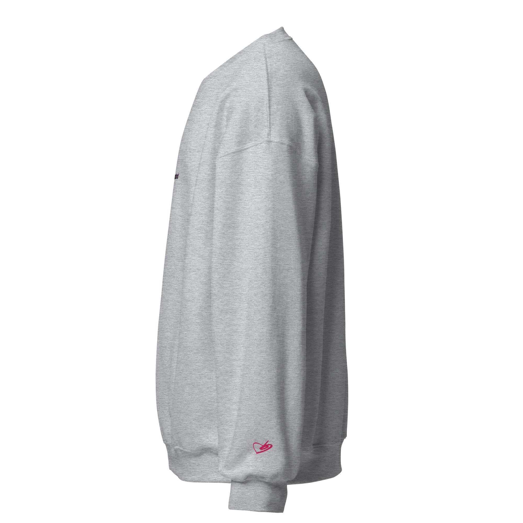 A close-up of The Upgraded Sweatshirt, highlighting the bold Upgraded text embroidered in fuschia on the chest, the soft air-jet spun fabric, and the detailed heritage logo print on the back.