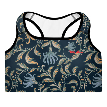 a close up of the venice performance bra featuring a parsley and floral pattern in dark blue with beige and light blue details, and the text City Babe printed at the top front left side.