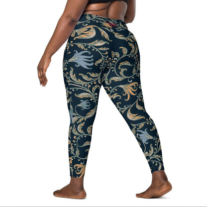 model wearing the Venice  high-waisted sculpt leggings featuring an intricate gold and slate-blue floral filigree print over a dark blue base
