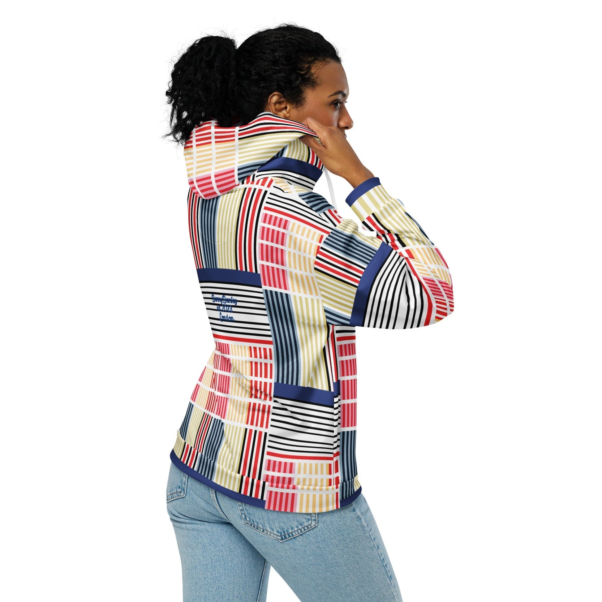 A model wearing The Vienna Zip Hoodie, showing the full-zip and the Art Nouveau graphic print in primary colors.