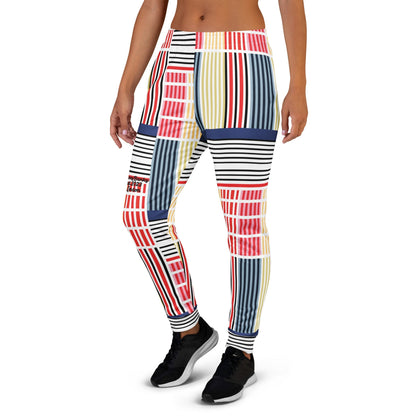 A model wearing The Vienna Slim Joggers, showing the narrow fit, cuffed ankles, and the Art Nouveau graphic print in primary colors.