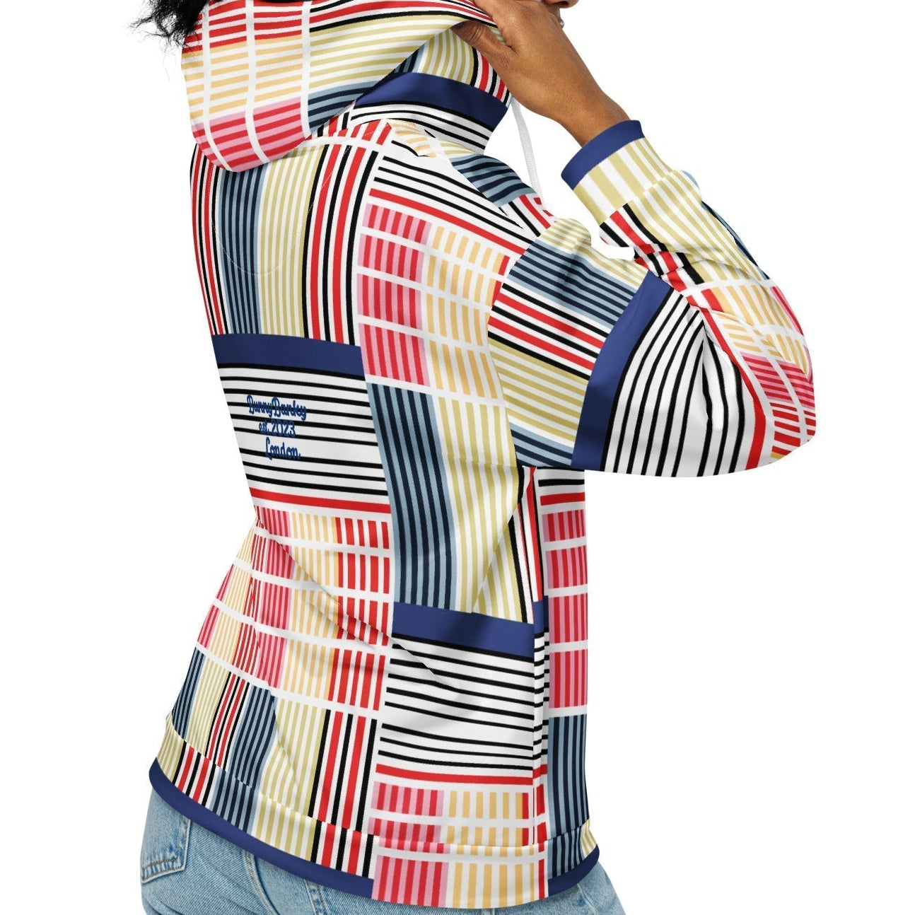 A model wearing The Vienna Zip Hoodie, showing the full-zip and the Art Nouveau graphic print in primary colors.